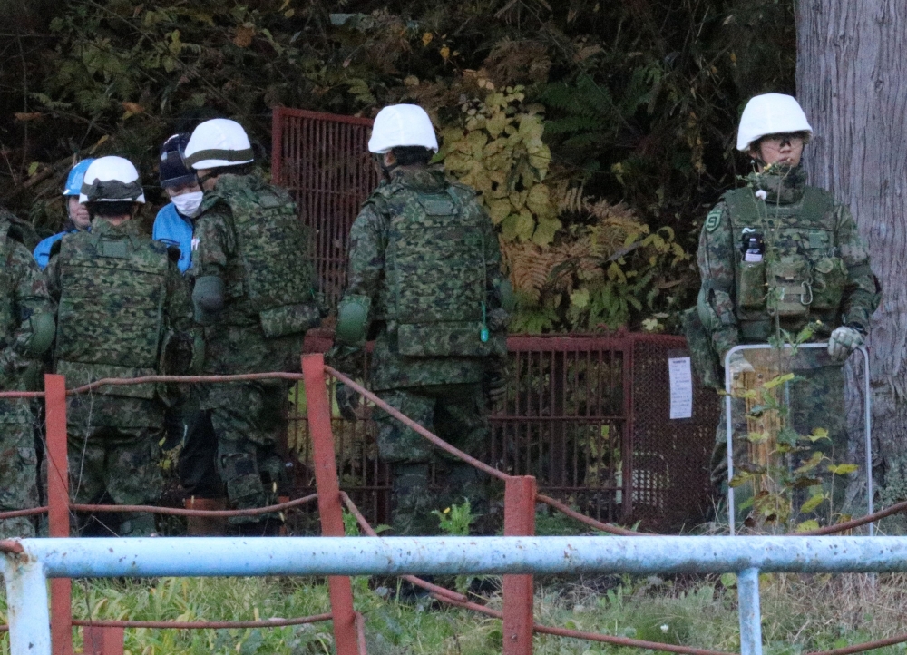 Members of Japan Self-Defense Forces (JSDF) practice setting up a bear trap in Kazuno, Akita Prefecture, Japan, November 5, 2025. — Reuters pic