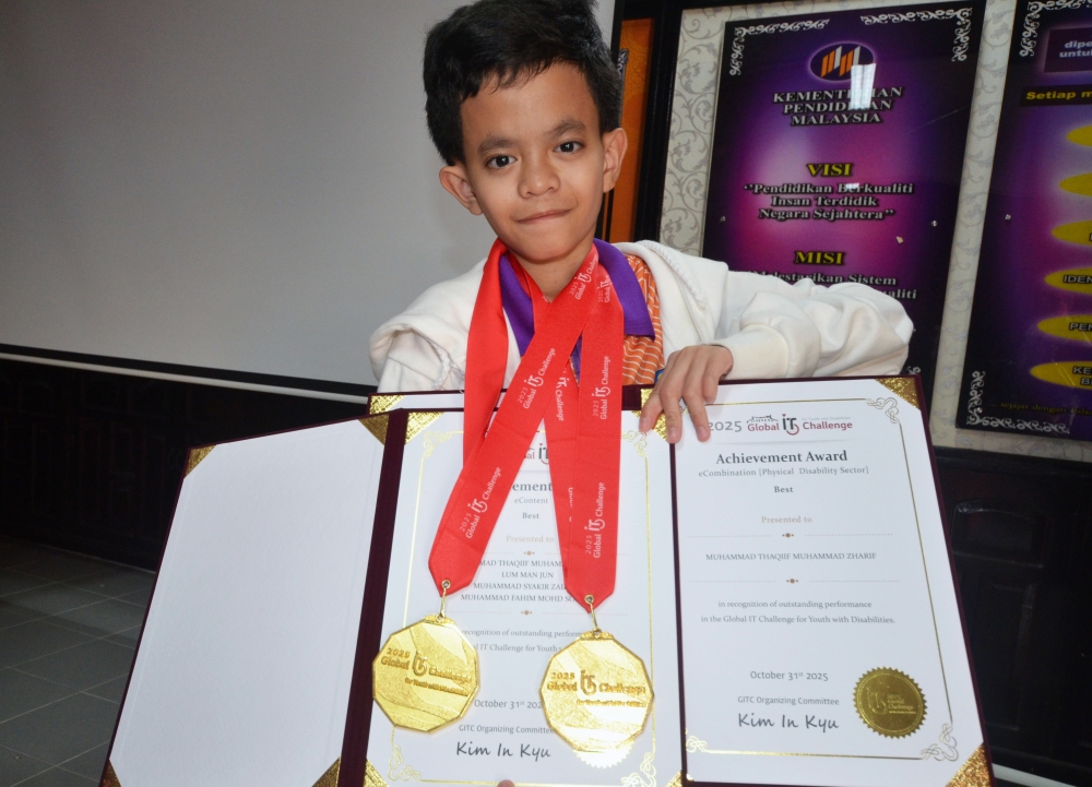 Malaysian duo with special needs shine in South Korea, win top honours at global IT event