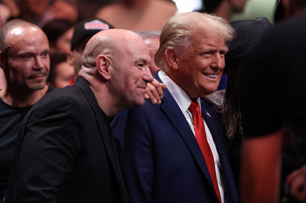 Joe Rogan and President-elect Donald Trump pose for a photo during the UFC 309 event at Madison Square Garden on November 16, 2024 in New York City. — Getty Images via AFP