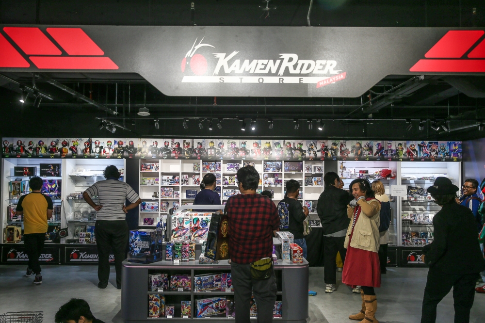 Fans explore Malaysia’s first official Kamen Rider Store. — Photo by Yusof Mat Isa