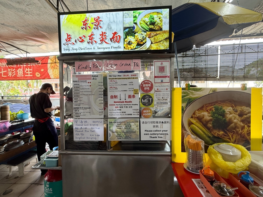 Find the stall at the back of the restaurant and wait for your noodles that is cooked upon order. — Picture by Lee Khang Yi
