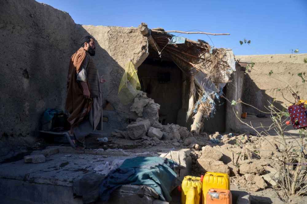 An Afghan man inspects a damaged house, following cross-border fire from Pakistan’s artillery shelling, at a village in the Spin Boldak district of Kandahar November 7, 2025. — AFP pic