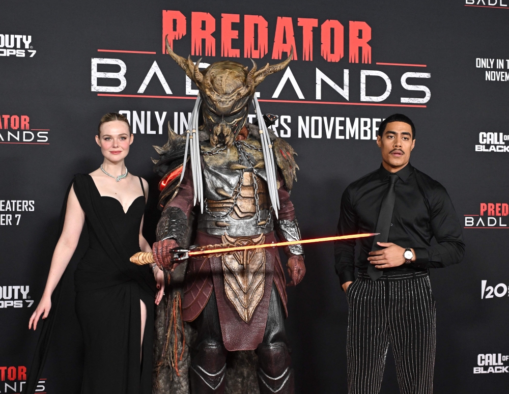 US actress Elle Fanning (left) and New Zealand actor Dimitrius Schuster-Koloamatangi attend the world premiere of 20th Century Studio's ‘Predator: Badlands’ at the TCL Chinese theatre in Los Angeles on November 3, 2025. — AFP pic