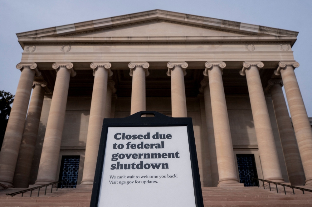Signage warning of closures due to the US government shutdown in front of the National Gallery of Art in Washington. US senators have reached a bipartisan agreement to restore federal funding and end the record 40-day government shutdown. — Reuters pic