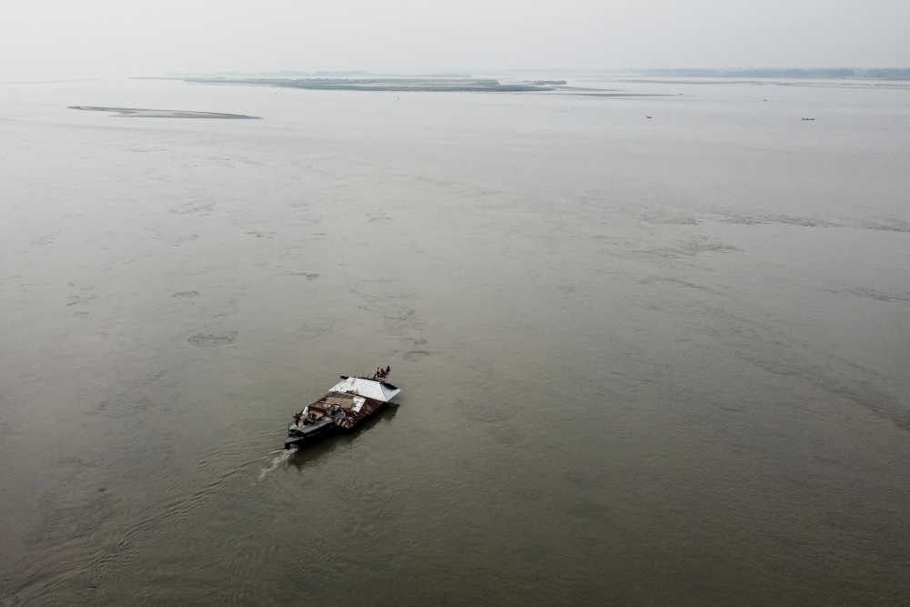 A drone view shows a boat carrying the house of Nurun Nabi, 30, who was forced to relocate to another island due to erosion caused by the Brahmaputra River, in Kurigram, Bangladesh, October 29, 2025. — Reuters pic 