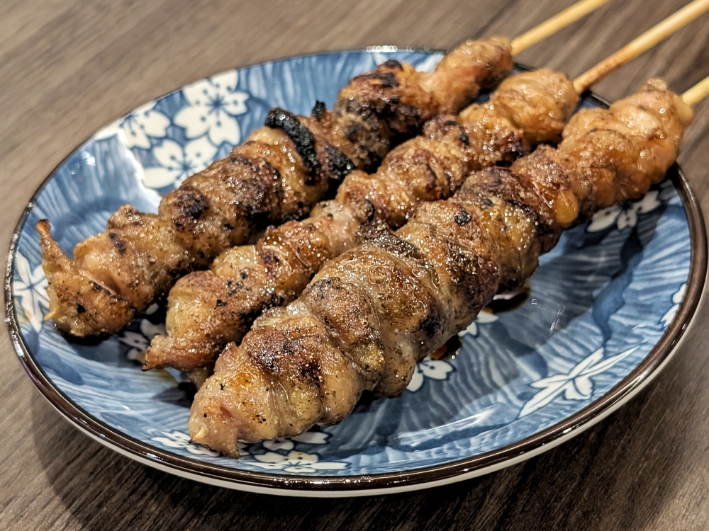 Chicken skin skewers that celebrate the rubbery texture of the part. — Picture by Ethan Lau