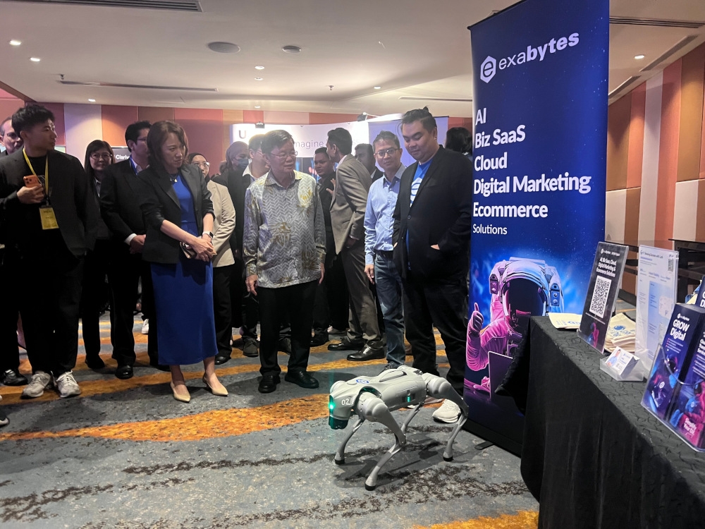 Penang chief minister Chow Kon Yeow (centre) visiting the booths at the 7th Penang GBS Conference 2025. — Picture by Opalyn Mok