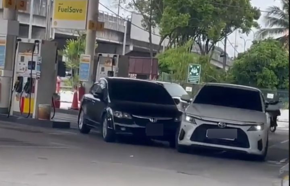 A still shows two cars colliding following the incident at a petrol station in Persiaran Raja Muda Musa, Klang.