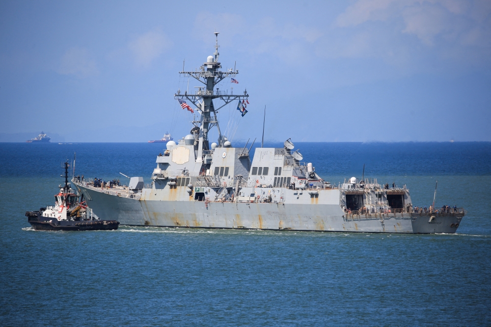 The US Navy destroyer USS Gravely (DDG-107) sails from the Port of Spain amid heightened tensions in the region between the US and Venezuela, as seen from Port of Spain, Trinidad and Tobago October 30, 2025. — Reuters pic