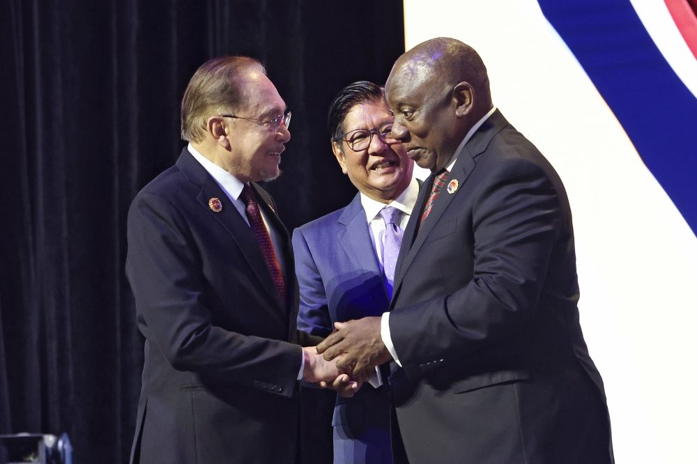 Prime Minister Datuk Seri Anwar Ibrahim shakes hands with South African President Matamela Cyril Ramaphosa during the opening of the 47th Asean Summit and Related Summits at the Kuala Lumpur Convention Centre today. — Bernama pic