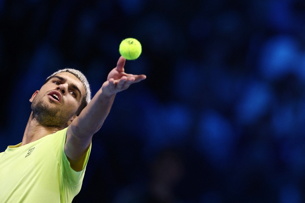Carlos Alcaraz knocked rival Jannik Sinner off the top of the standings on Thursday after securing the year-end world number one spot by beating Lorenzo Musetti at the ATP Finals 6-4, 6-1 in Turin. — Reuters pic