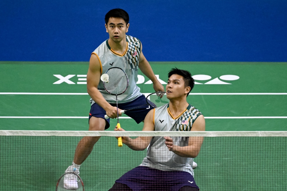 Malaysia’s Nur Izzuddin and Goh Sze Fei during the men’s doubles semi-final match at the India Open 2025 in New Delhi on January 18, 2025. — AFP pic