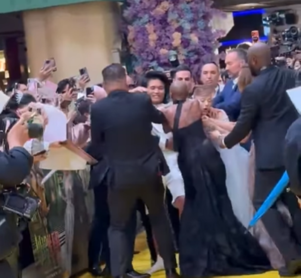 A man disrupted the yellow carpet at Resorts World Sentosa during the premiere of Wicked: For Good, charging towards singer Ariana Grande in an incident caught on video. — Screengrab of the incident via Instagram