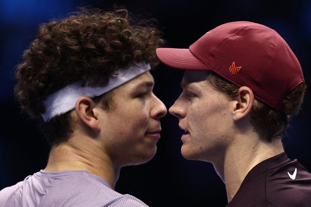 Italy's Jannik Sinner shakes hands with Ben Shelton of the US after winning their ATP Finals group stage match at Palasport Olimpico, Turin November 14, 2025. — Reuters pic  