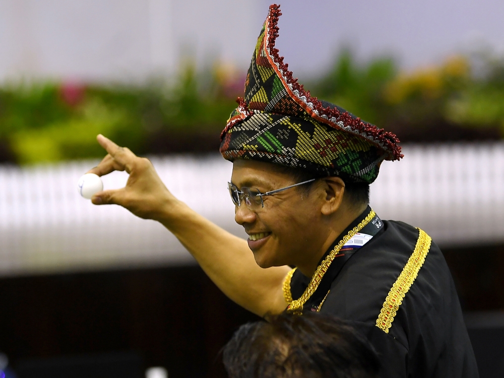 Incumbent Inanam assemblyman and PKR candidate Datuk Peto Galim shows his ballot draw number after submitting his nomination papers for the 17th Sabah state election at Dewan Maksak Kota Kinabalu in Kota Kinabalu November 15, 2025. — Bernama pic