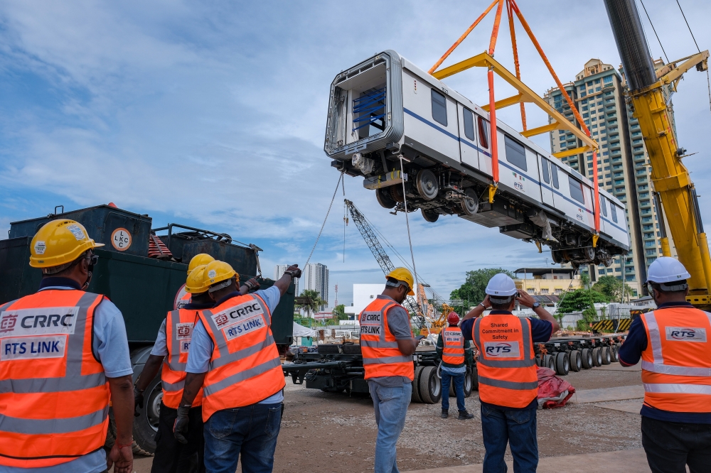 RTSO engineers overseeing the placement of Train Set 02 onto the tracks at Wadi Hana Depot in Johor Bahru November 15, 2025, a major milestone for the RTS Link project. — Bernama pic