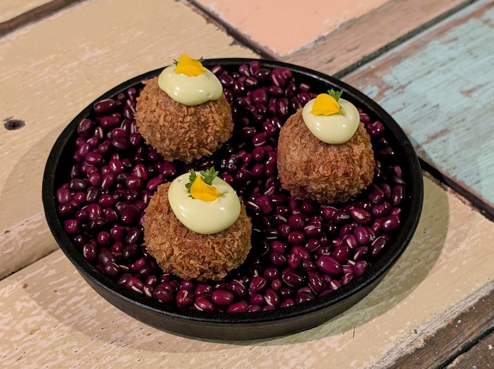 ‘Croquetas de carne’ are crispy balls of meat, topped with a basil mayonnaise. — Picture by Ethan Lau