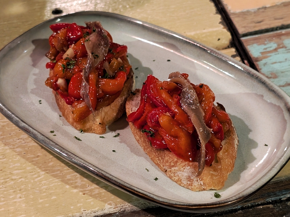 The ‘pincho’ with Cantabrian anchovies and roasted red peppers is fantastic. — Picture by Ethan Lau