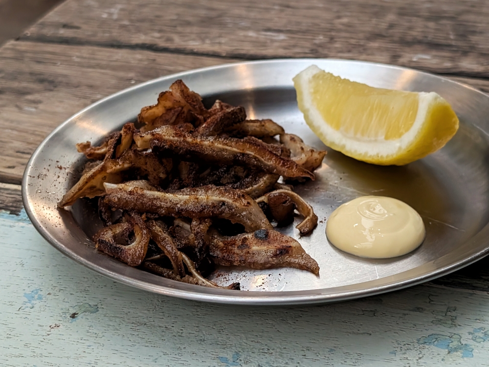 Grilled pig’s ears, or ‘oreja de la plancha’ is a classic ‘tapas’ dish from Madrid. — Picture by Ethan Lau