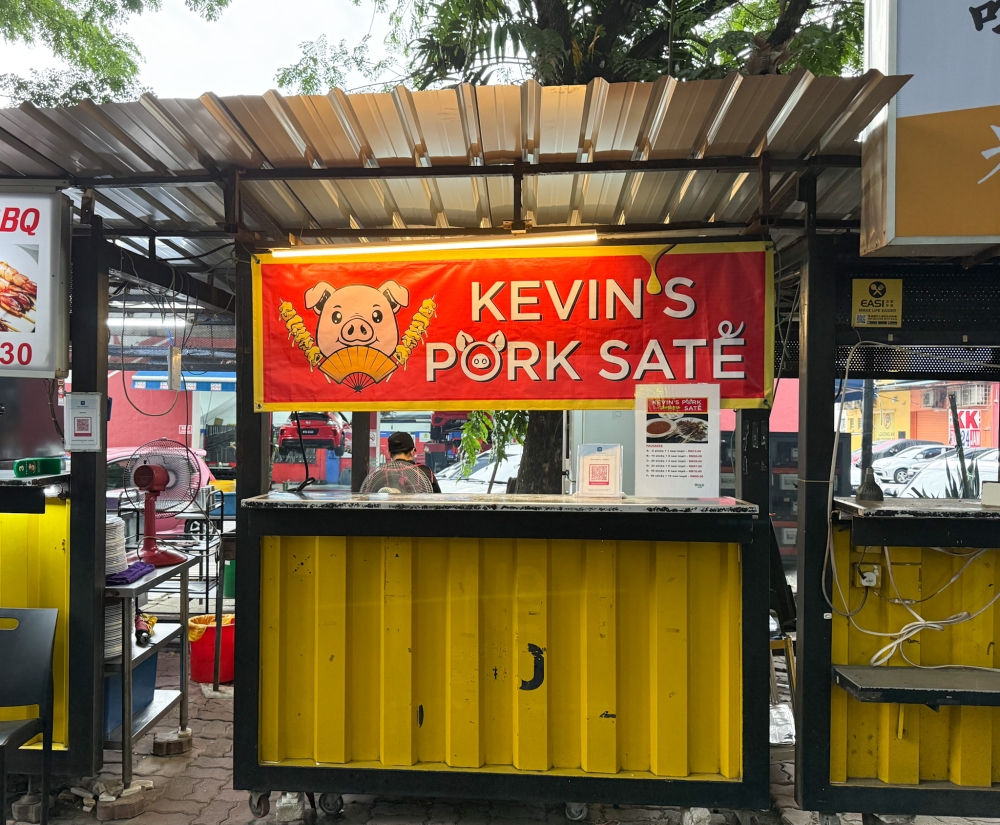 The stall is at the edge of this vast food establishment where it’s placed with other stalls that also use fire for cooking. — Picture by Lee Khang Yi