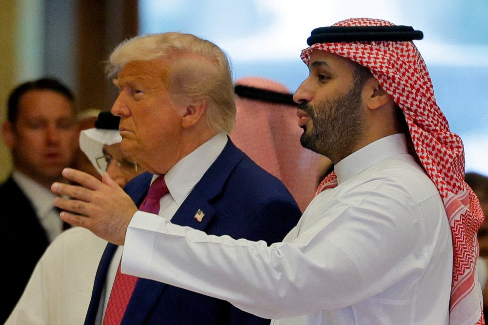 Saudi Crown Prince Mohammed Bin Salman speaks with US President Donald Trump on the day of the Saudi-US Investment Forum, in Riyadh, Saudi Arabia, May 13, 2025. — Reuters pic
