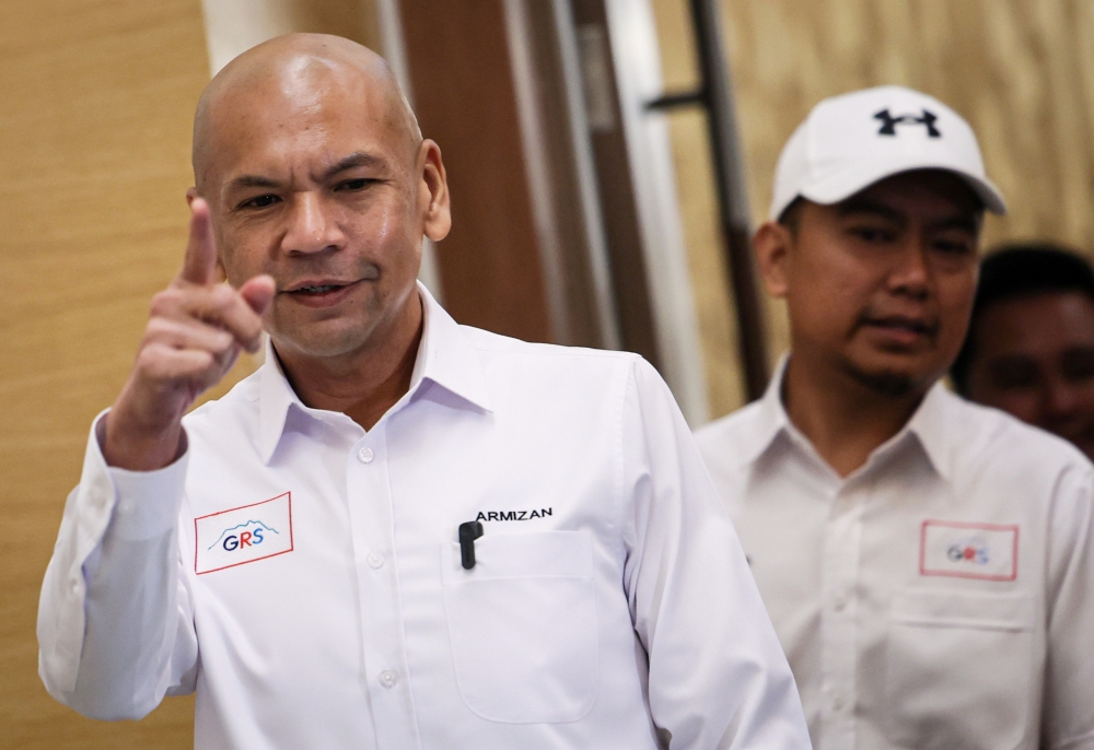 GRS deputy secretary-general Datuk Armizan Mohd Ali (left) speaks at a media briefing on the coalition’s election manifesto at the Sabah International Convention Centre on November 17, 2025 in Kota Kinabalu. — Bernama pic