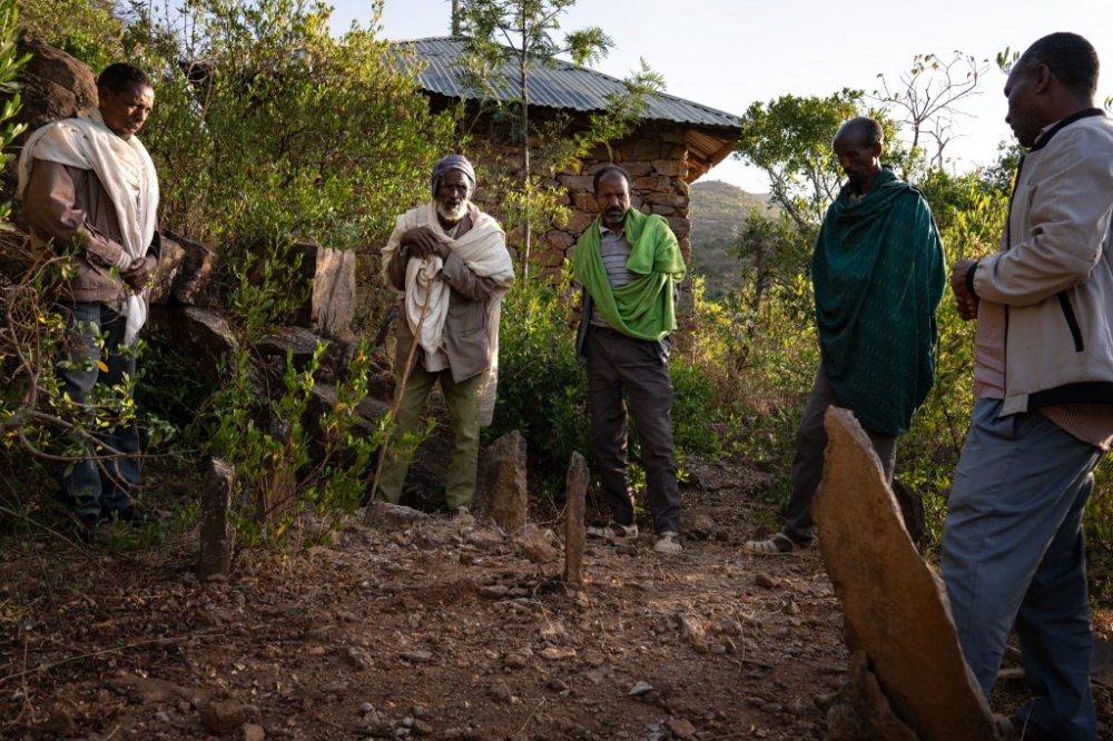 A group of diggers and a relative of the victims prepare to open a mass grave containing three bodies on a mountain in Adwa, Ethiopia on March 31, 2025. — AFP pic