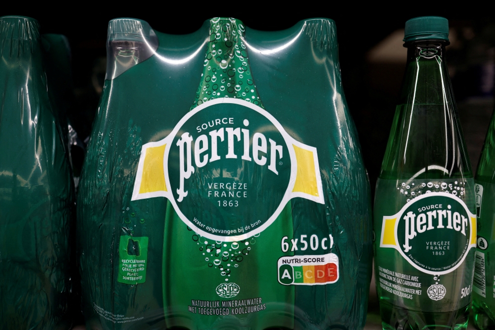 Perrier’s iconic green bottles are at the centre of a legal showdown in France, where a court is set to rule on claims the brand’s ‘natural’ mineral water is misleadingly marketed. — Reuters pic