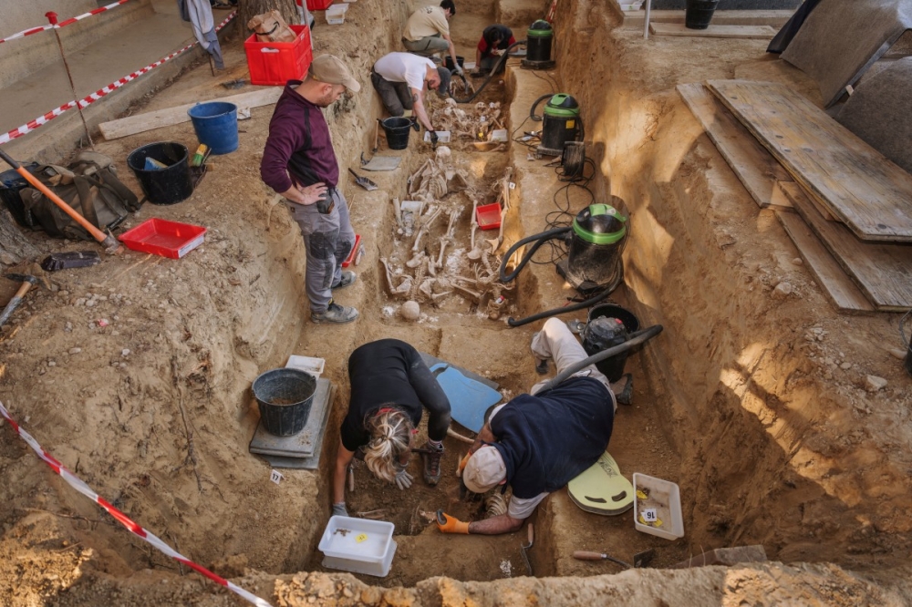 Staff and volunteers exhume around 150 victims of the Spanish Civil War and Franco regime in Ejea de los Caballeros, Zaragoza, on October 28, 2025. — AFP pic