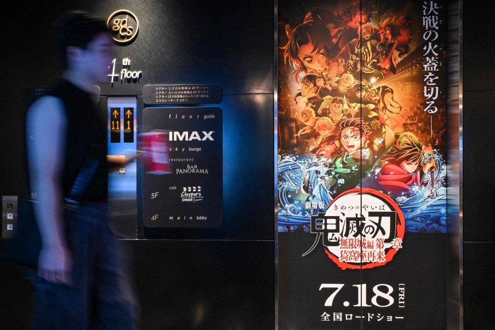 ‘Demon Slayer: Infinity Castle – Part 1’ becomes the first Japanese film to surpass ¥100 billion (RM2.69 billion) worldwide, cementing Tanjiro’s saga as a global anime juggernaut. — AFP pic