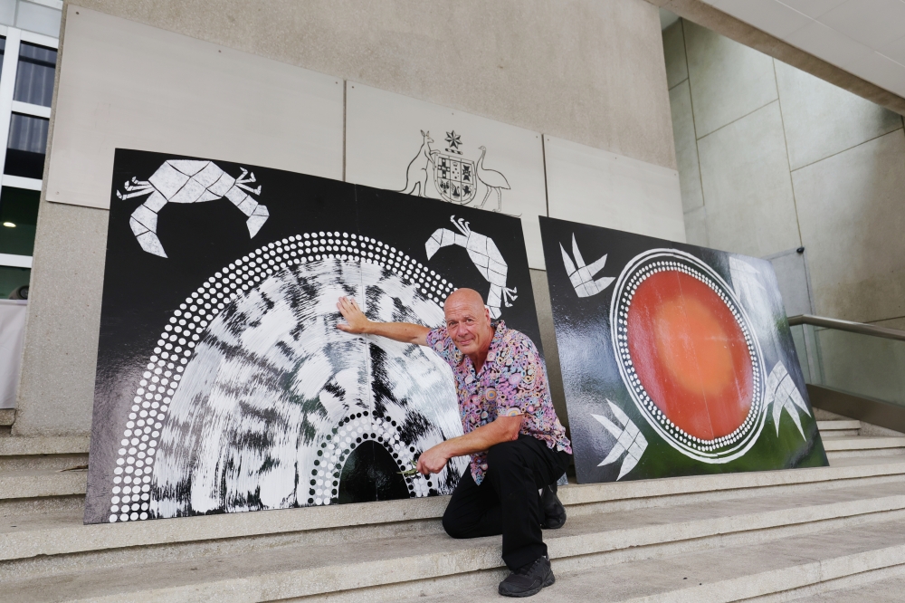 Australian designer Professor Wayne Quilliam with the Palawa art developed with Malaysian Orang Asli artist Shaq Koyok on permanent public display on the High Commission’s front fence at Jalan Yap Kwan Seng in Kuala Lumpur. — Picture courtesy of the Australian High Commission
