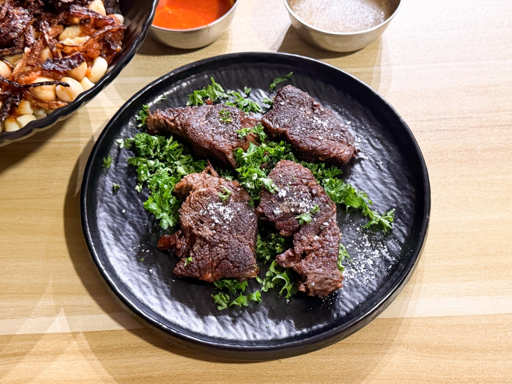 Pair the Koshari with grilled meat, easily pulled apart to tender strands. — Picture by Lee Khang Yi