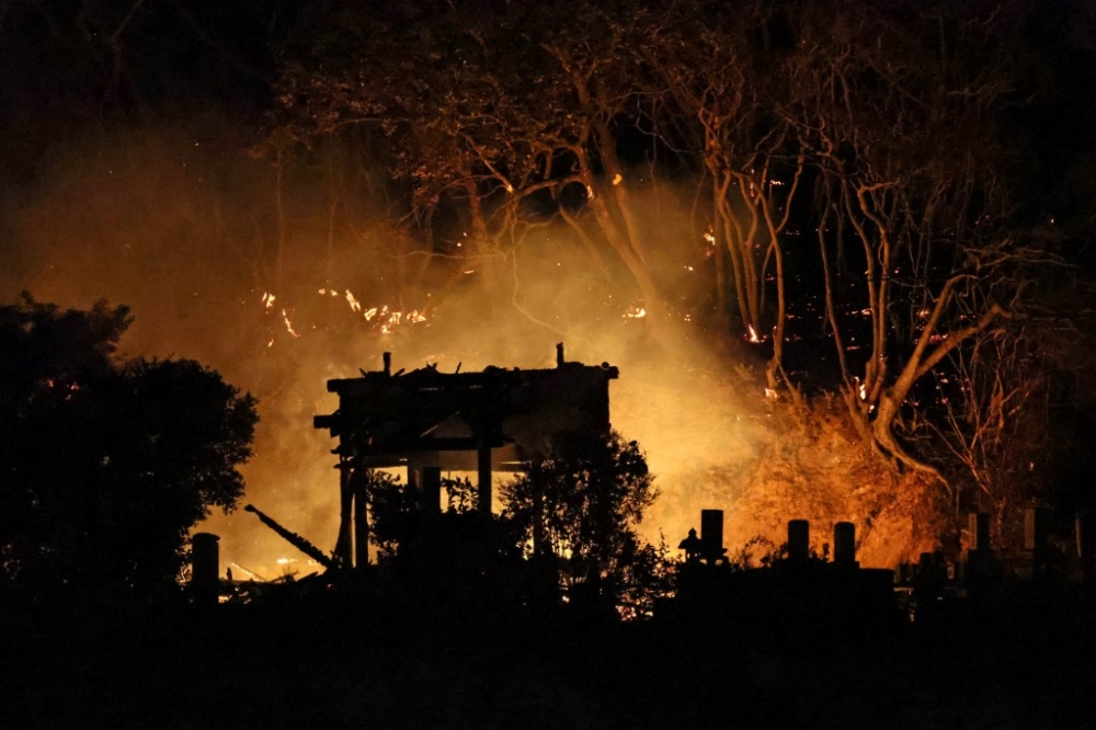 Firefighters were still struggling to extinguish the blaze in the southern city of Oita as it spread to a forested mountain nearby, public broadcaster NHK reported. — The Yomiuri Shimbun via AFP