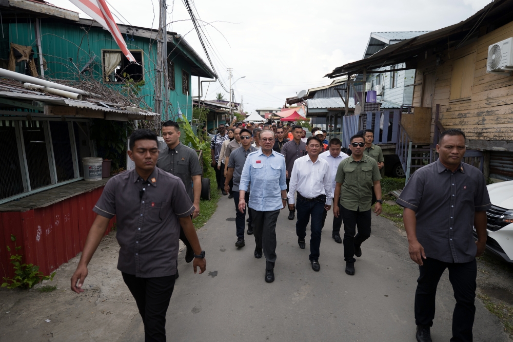 Prime Minister Datuk Seri Anwar Ibrahim visits Kampung Petagas in Putatan November 15, 2025. — Bernama pic
