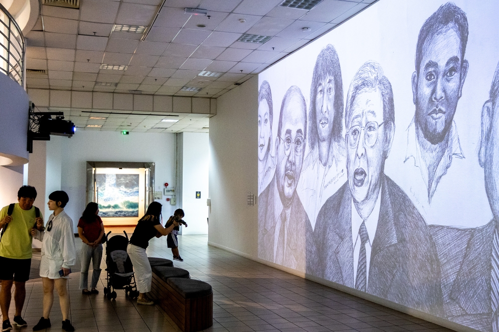 Visitors explore the main hall of the National Art Gallery. — Picture by Firdaus Latif