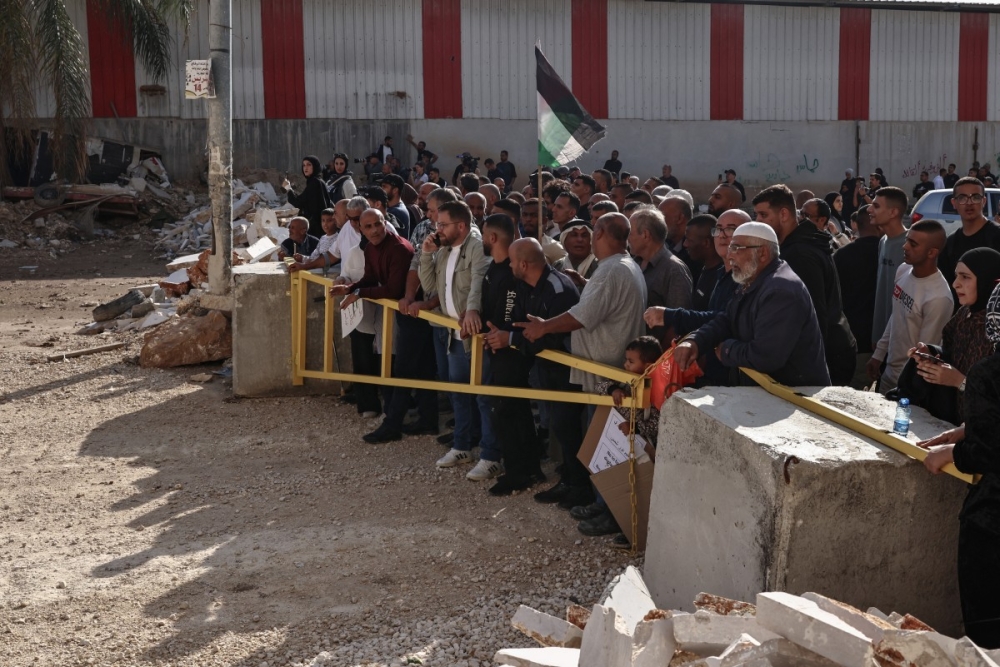 Residents of the Nur Shams refugee camp, near Tulkarem in the Israeli-occupied West Bank, gather at the entrance of the camp during a protest demanding the right to return to their homes. — AFP pic 