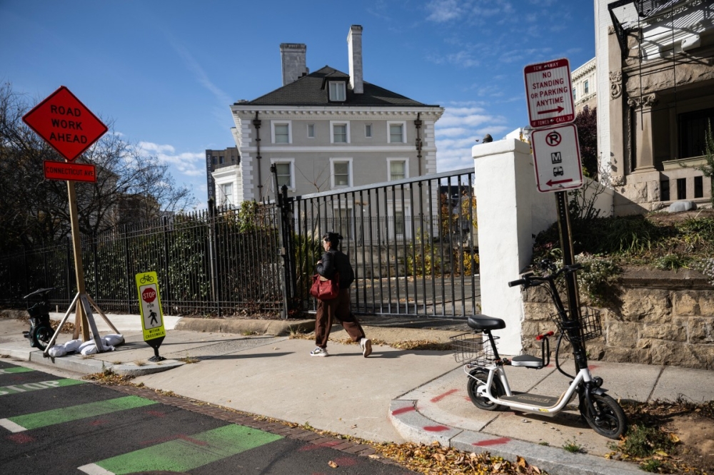 A woman walks past the former Russian Trade Mission in Washington, DC. — AFP pic 