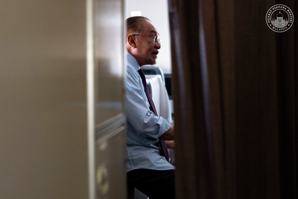 Prime Minister Datuk Seri Anwar Ibrahim speaks to Malaysian journalists on board a flight from Ethiopia to South Africa on Thursday. He said the Sabah election is also a platform for the people of Sabah to make an informed assessment of the various initiatives undertaken by the Madani Government in the state. — Picture from X/Anwar Ibrahim   