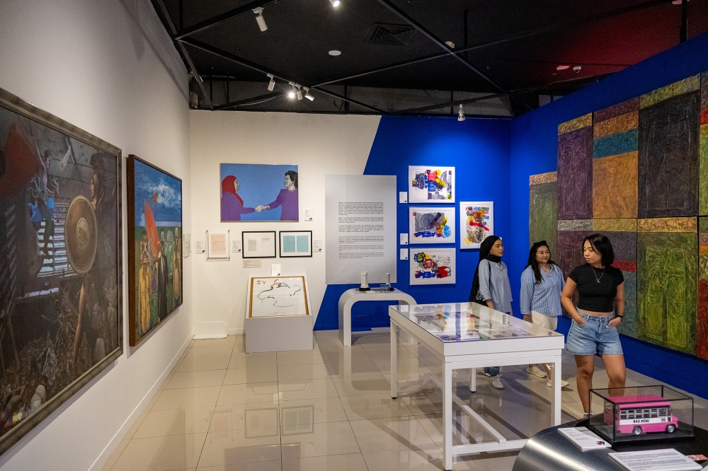 Visitors exploring the exhibits at Balai Seni Negara. — Picture by Firdaus Latif