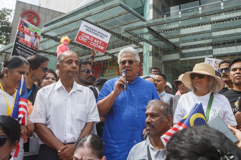 Former law minister Datuk Zaid Ibrahim (in blue) speaks during the Indira Gandhi Justice March in Kuala Lumpur November 22, 2025. Also present are Indira Gandhi (far left), Deputy Law Minister and Ipoh Barat MP M. Kulasegaran (2nd left) and Marina Mahathir (right). — Picture by Raymond Manuel