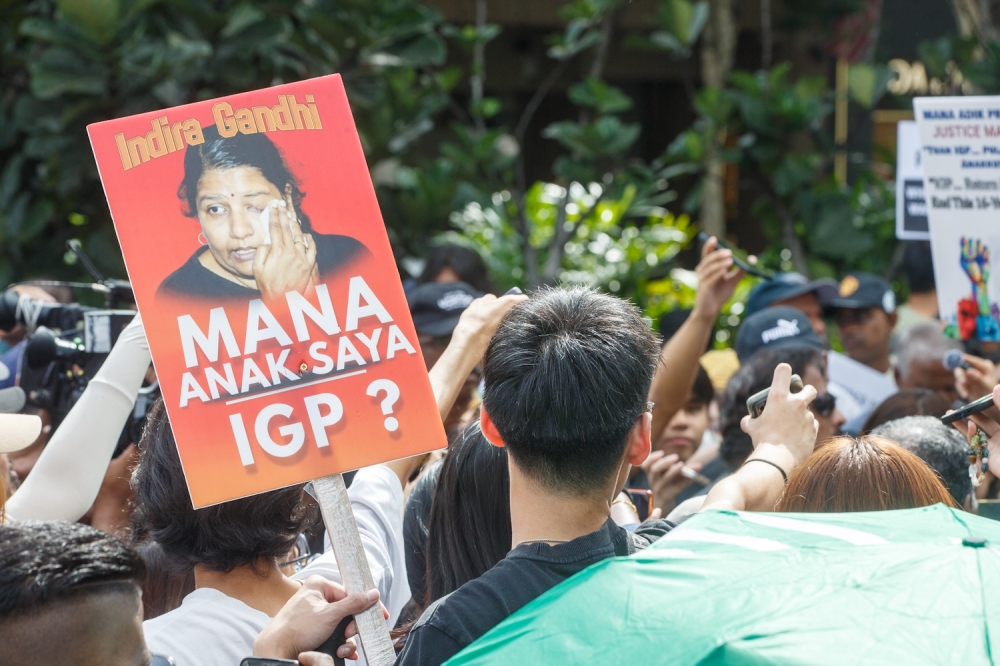 Participants hold placards during the Indira Gandhi Justice March from Sogo Kuala Lumpur to Bukit Aman to deliver her daughter’s teddy bear, in Kuala Lumpur November 22, 2025. — Picture by Raymond Manuel