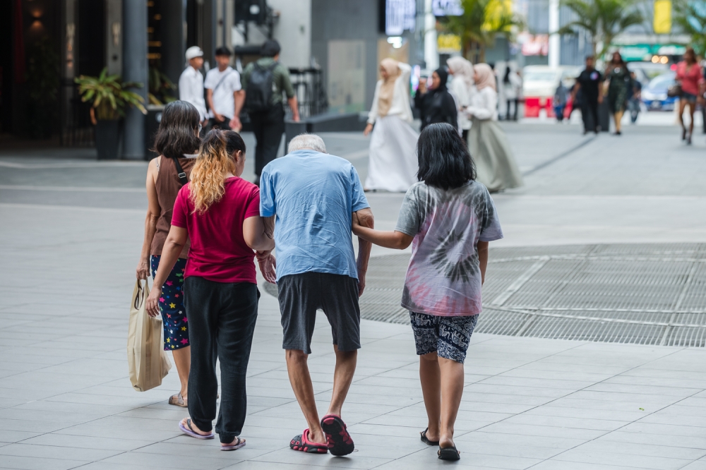 With urban migration and smaller family sizes, many elderly individuals are now living alone or with limited assistance. — Picture by Raymond Manuel