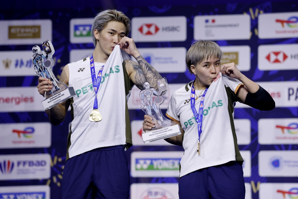 Mixed doubles gold medallists Malaysia’s Chen Tang Jie and Toh Ee Wei celebrate on the podium at the BWF World Championships at Adidas Arena, Paris, August 31, 2025. — Reuters pic