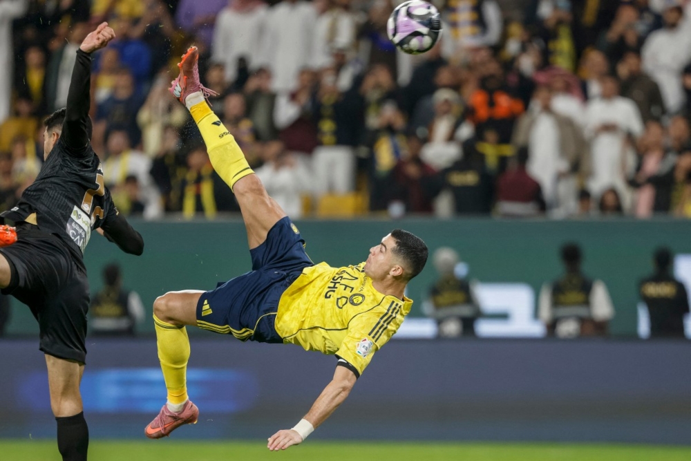 Nassr’s Portuguese forward #07 Cristiano Ronaldo kicks the ball to score his team’s fourth goal during the Saudi Pro League football match between Al-Nassr and Al-Khaleej at Al-Awwal Park in Riyadh on November 23, 2025. — AFP pic 