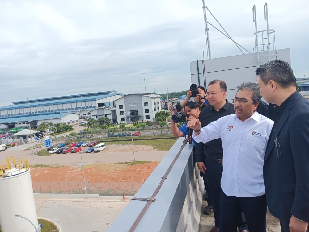 Plantations and Commodities Minister Datuk Seri Johari Abdul Ghani is seen during a working visit to the Ecoceres Renewable Fuels Sdn Bhd production plant at Tanjung Langsat in Pasir Gudang, November 24, 2025. — Picture by Ben Tan