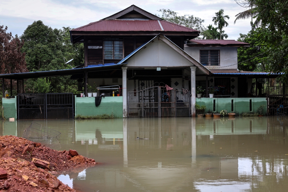 A house is flooded after heavy rain at Kampung Desa Puri in Tasek Gelugor on November 24, 2025. — Bernama pic