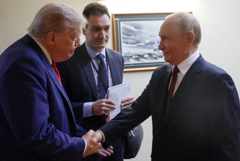 US President Donald Trump shakes hands with Russian President Vladimir Putin before a joint news conference following their meeting at Joint Base Elmendorf-Richardson in Anchorage, Alaska, August 15, 2025. — Sputnik via Reuters