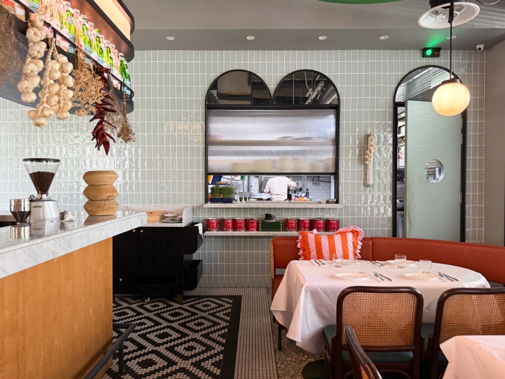 A laid-back setting brightened up with frilly pink cushions makes this a good place for a leisurely meal plus one can sneak a peek into the kitchen to watch chef Paulo Mauceri at work. — Picture by Lee Khang Yi