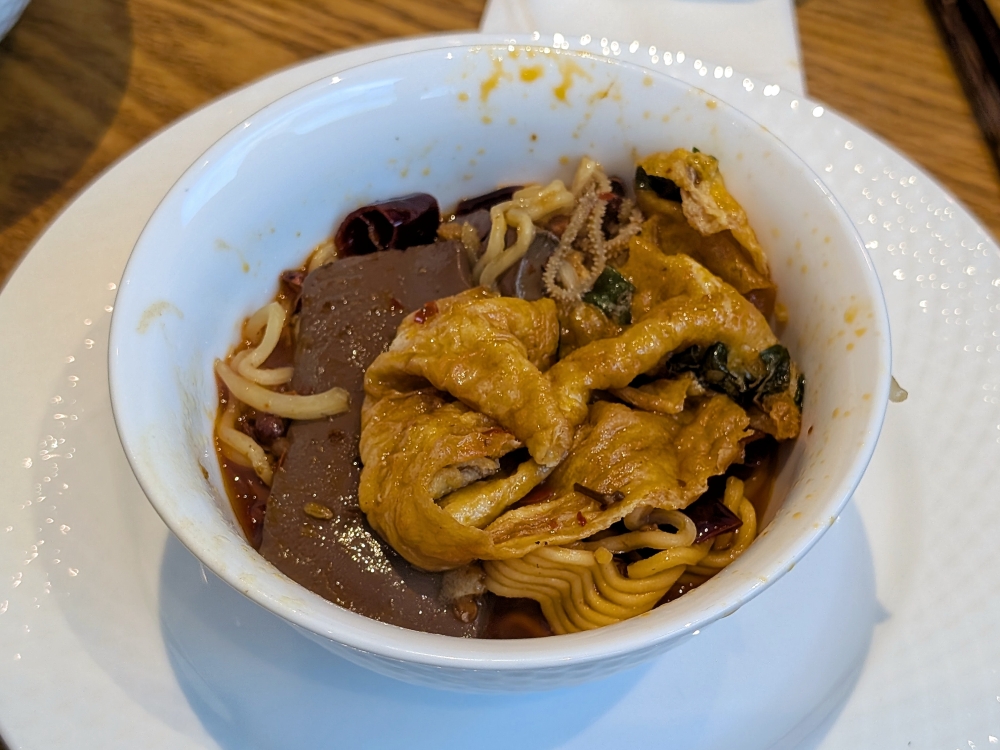 Make yourself a bowl of the ‘mao xue wang’, and be sure to get the blood and fried egg, which are the best bits. — Picture by Ethan Lau