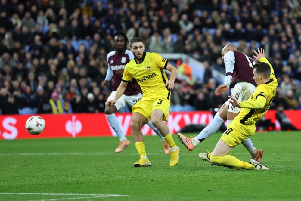 Aston Villa’s Dutch defender #17 Donyell Malen (2nd right) shots past Young Boys’ Algerian defender #03 Jaouen Hadjam to scores his team’s second goal during the Uefa Europa League league-stage football match between Aston Villa and Young Boys at Villa Park in Birmingham on November 27, 2025. — AFP pic 